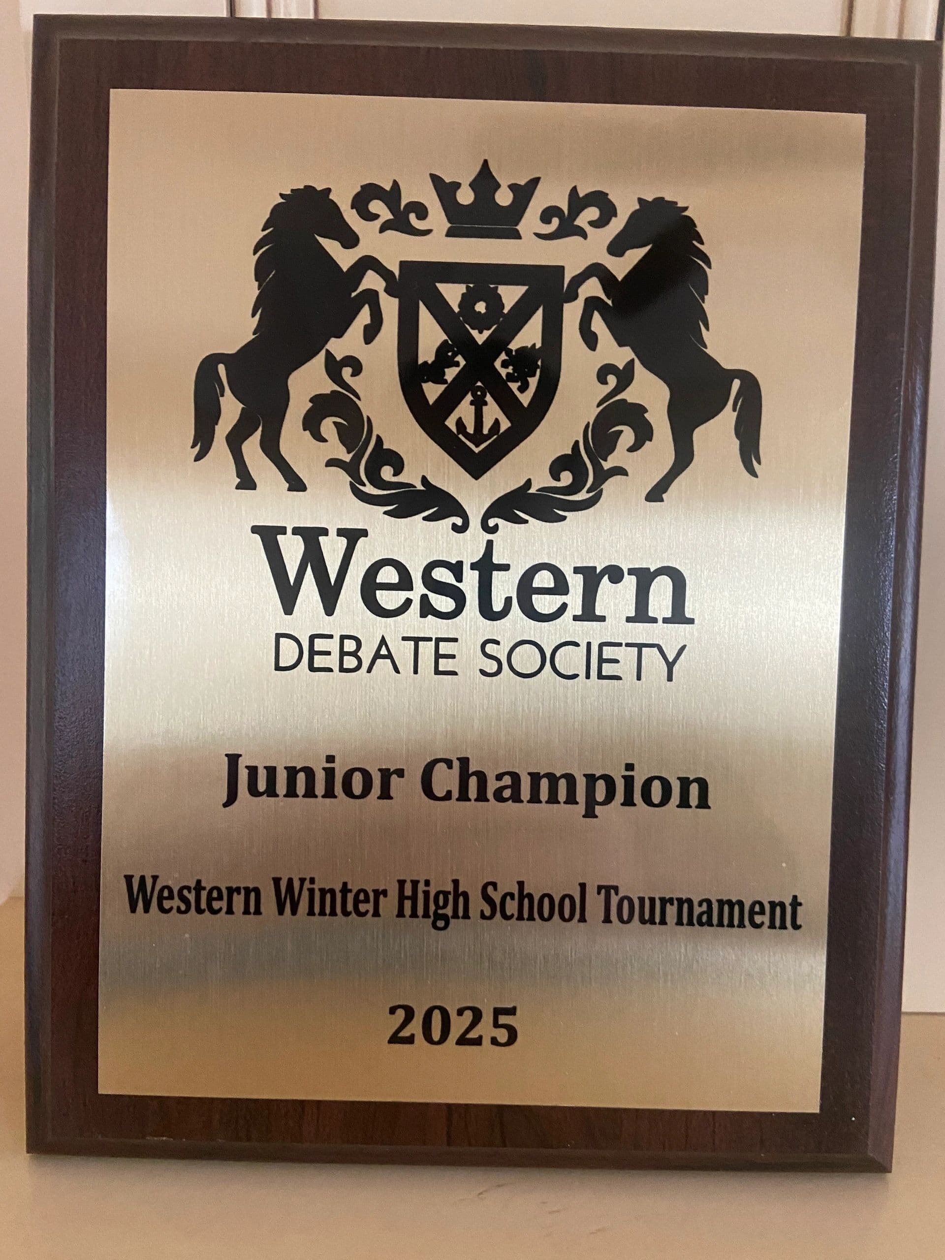 Plaque for Junior Champion of the Western Winter Debate Tournament 2025.